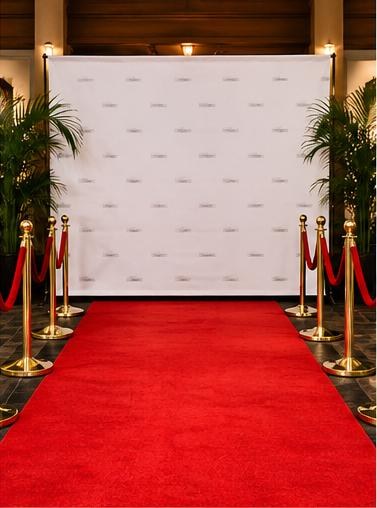 Red-carpet entrance with gold stanchions, red velvet ropes and a step-and-repeat backdrop